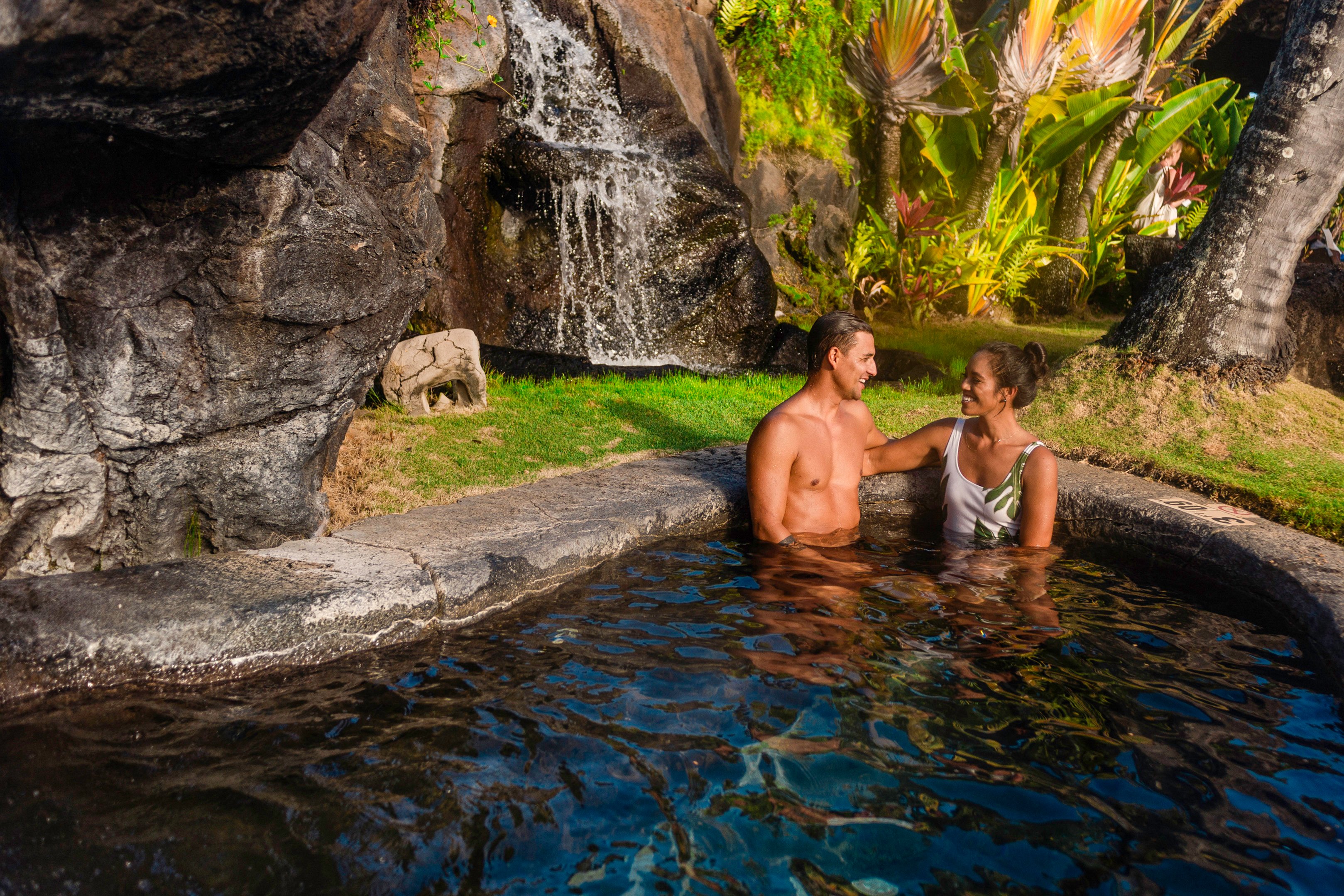 Couple in the pool at OUTRIGGER Kauai Beach Resort & Spa