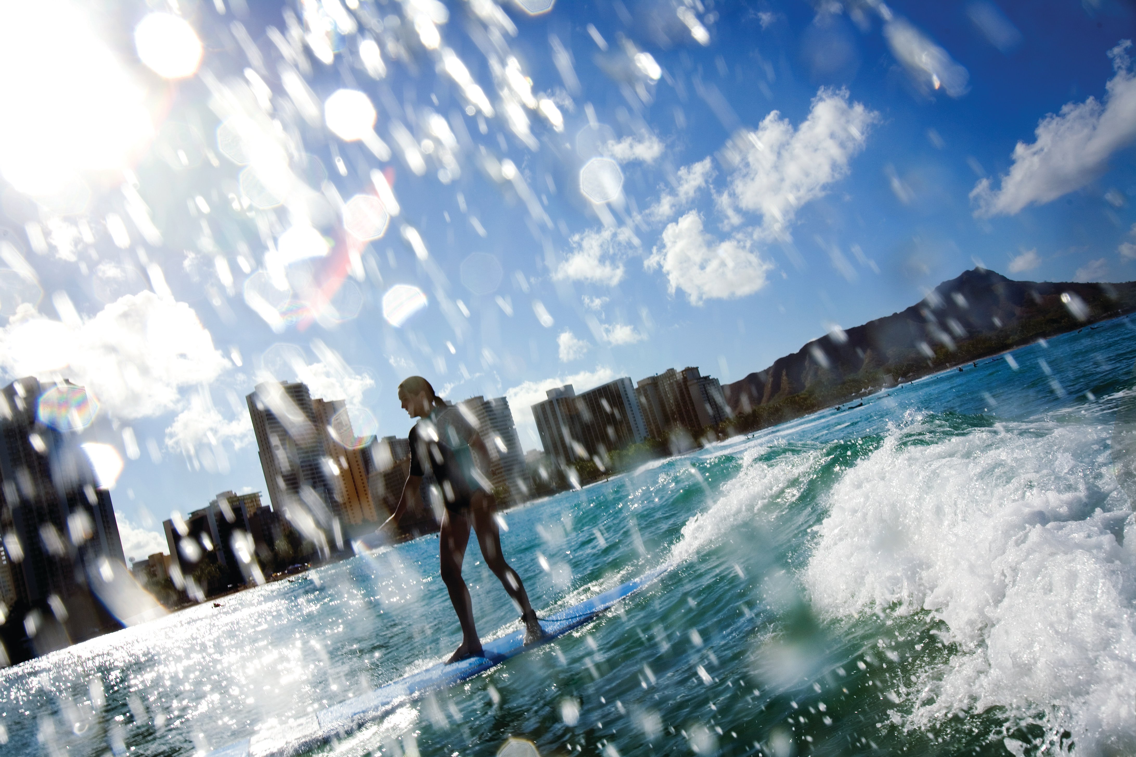 Girl surfing in Waikiki